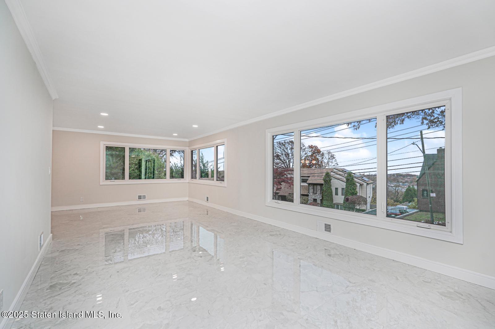 113 Longview Road Staten Island, NY 10304 - Photo 22 of 35 a view of an empty room with a window