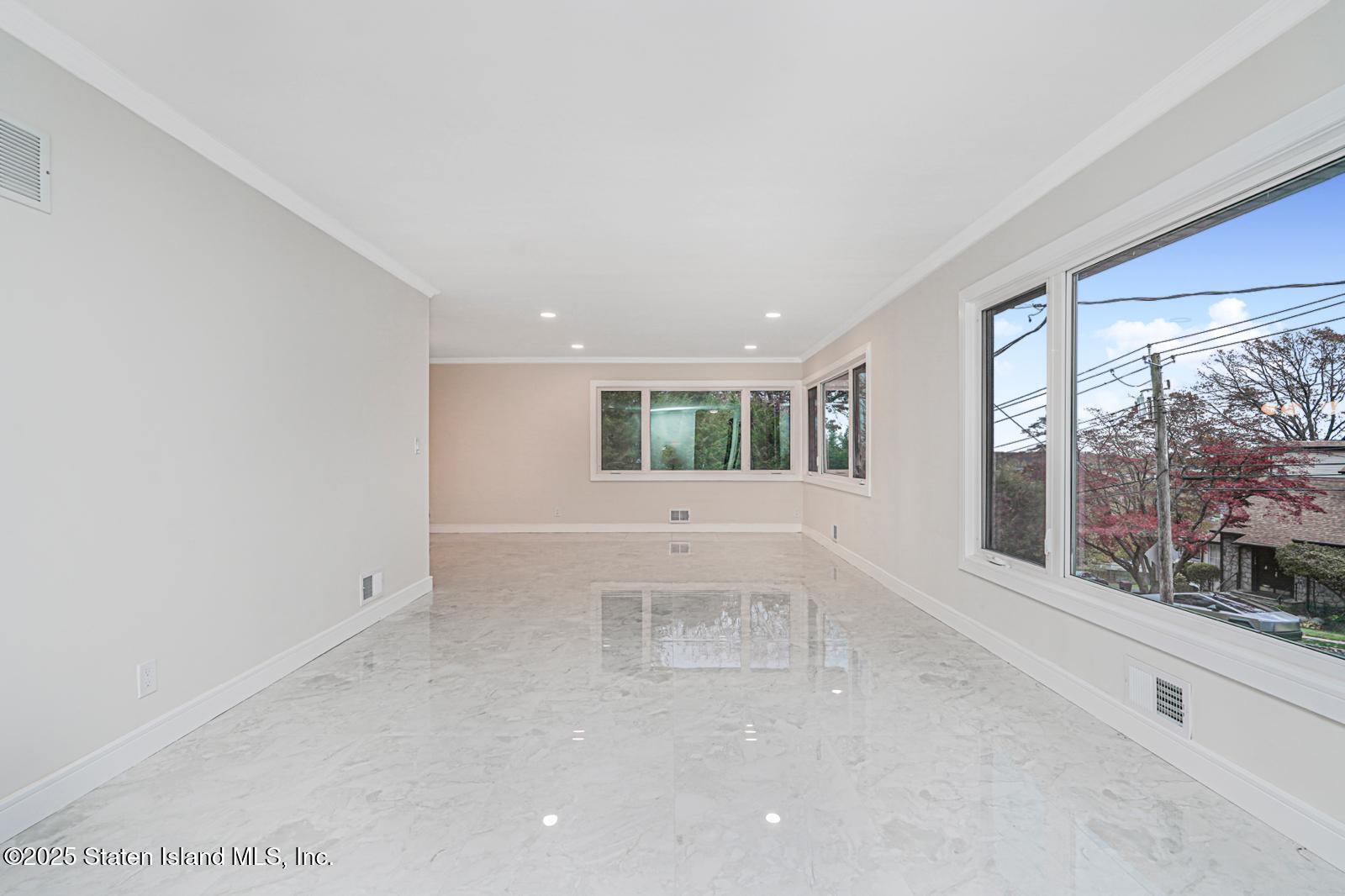 113 Longview Road Staten Island, NY 10304 - Photo 23 of 35 a view of empty room with large window