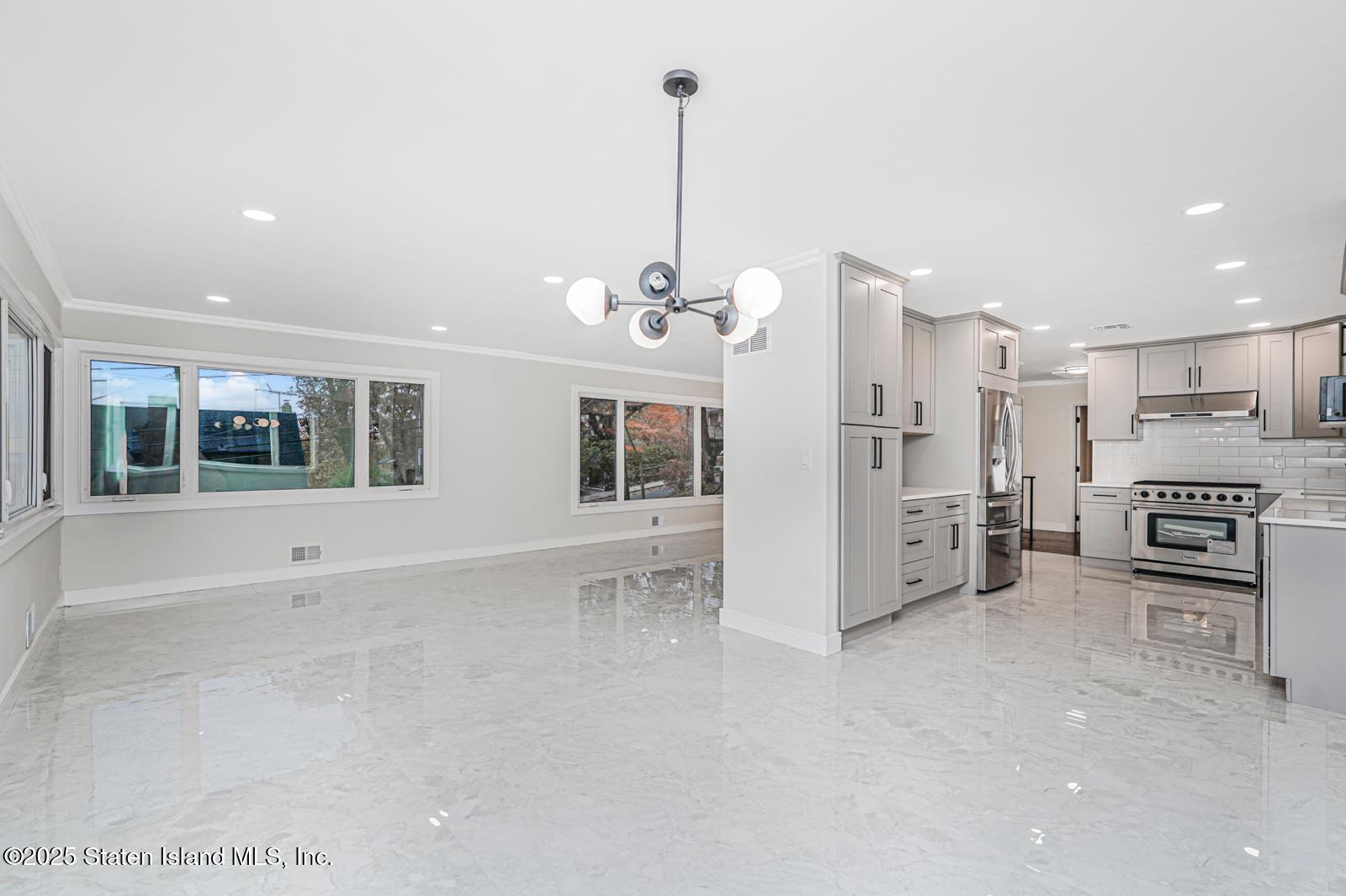 113 Longview Road Staten Island, NY 10304 - Photo 26 of 35 a view of a kitchen with refrigerator and cabinets