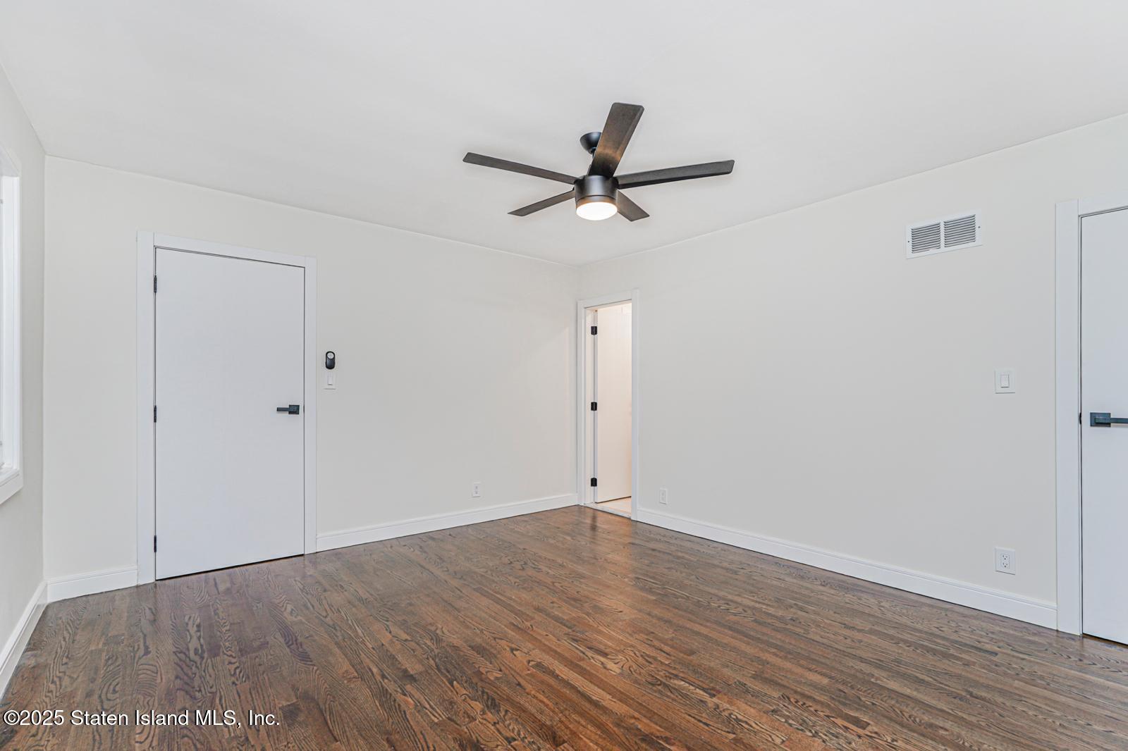 113 Longview Road Staten Island, NY 10304 - Photo 29 of 35 wooden floor in an empty room