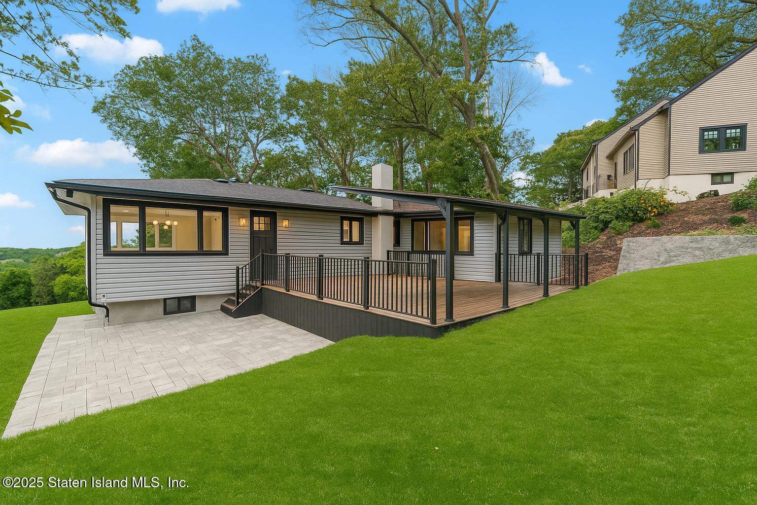 113 Longview Road Staten Island, NY 10304 - Photo 3 of 35 a view of backyard with deck and a yard