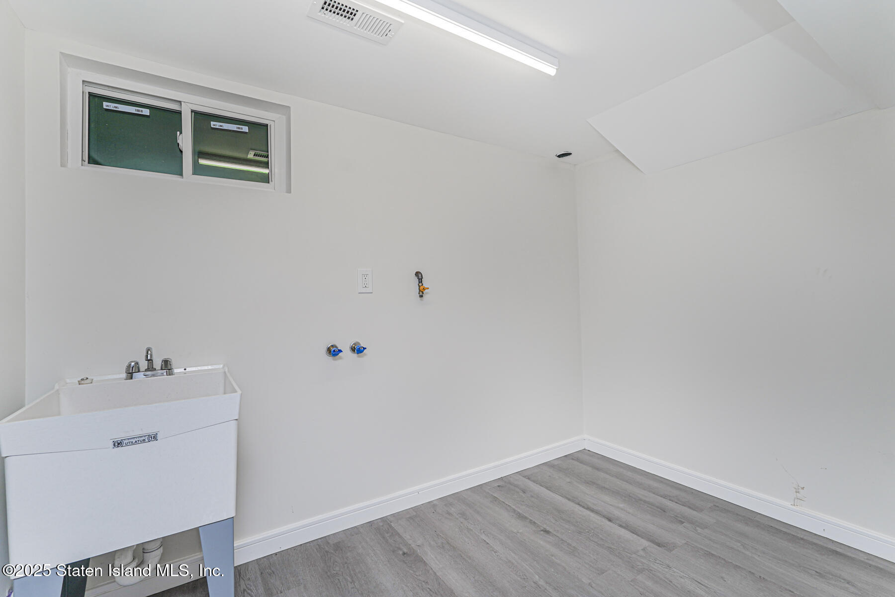 113 Longview Road Staten Island, NY 10304 - Photo 32 of 35 a view of a room with wooden floor