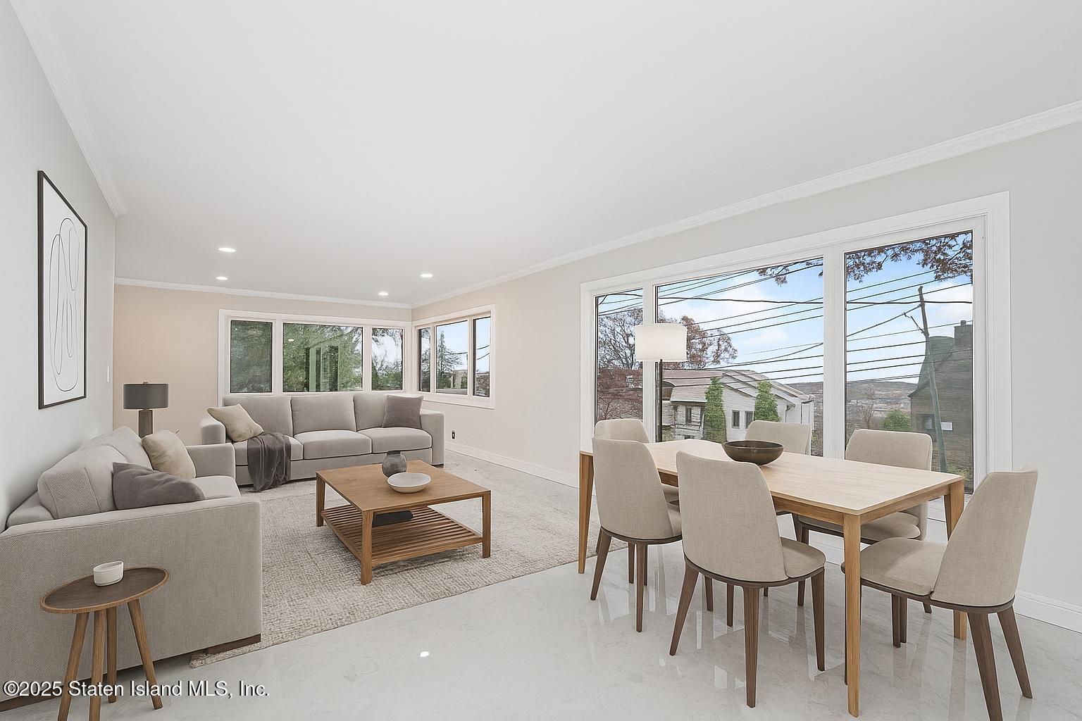 113 Longview Road Staten Island, NY 10304 - Photo 9 of 35 a living room with furniture and a large window