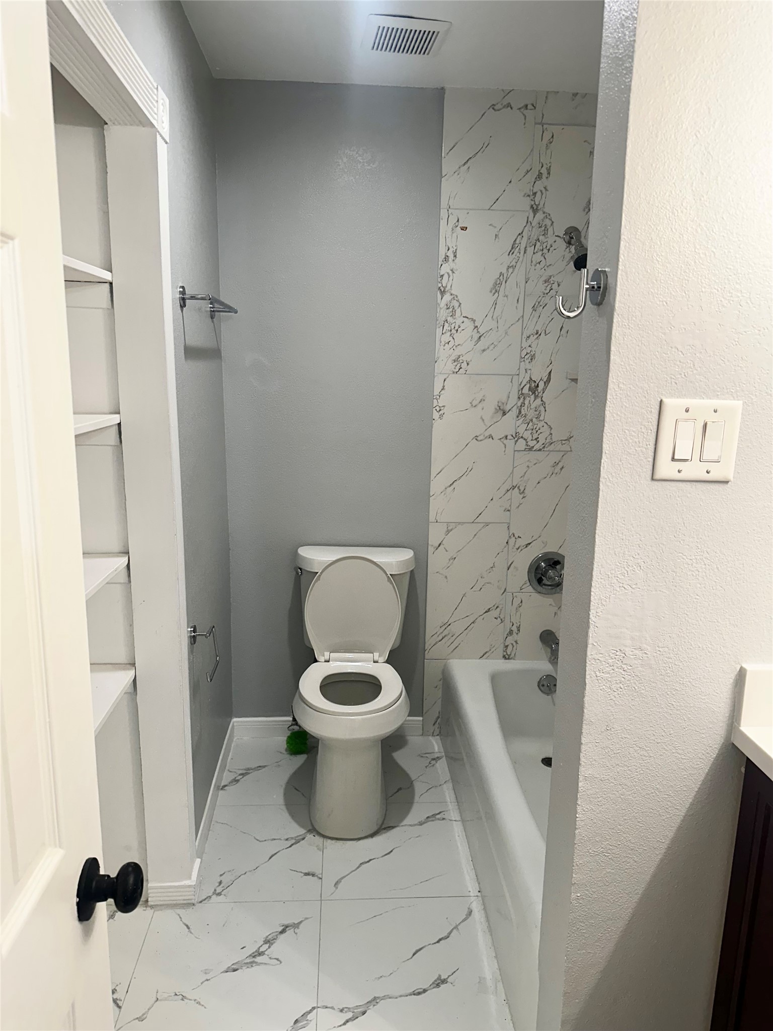 9505 Neuens Road, Unit 10 Houston, TX 77080 - Photo 6 of 7 a bathroom with a toilet and a shower