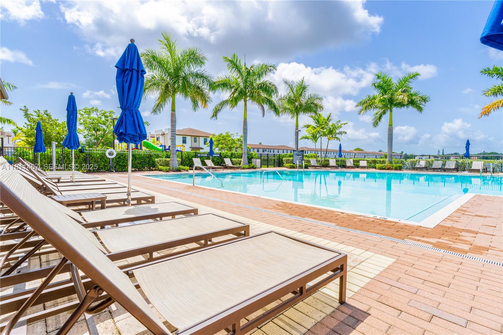 817 Northeast 211th Street Miami, FL 33179 - Photo 16 of 20 a view of a terrace with a lake view