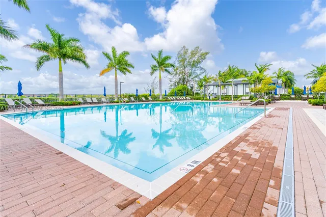a view of swimming pool with a table and chairs