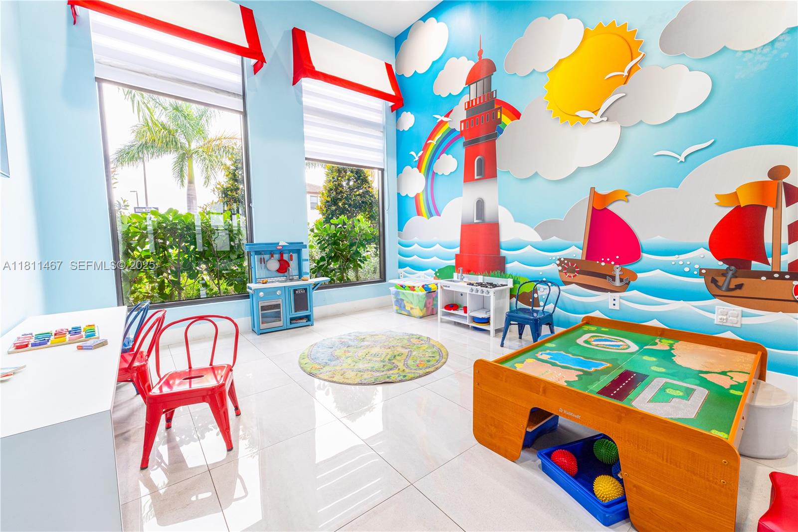 817 Northeast 211th Street Miami, FL 33179 - Photo 19 of 20 a play room with toys and a potted plant