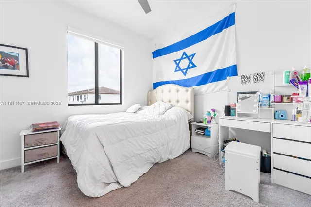 a bedroom with a bed and a couch