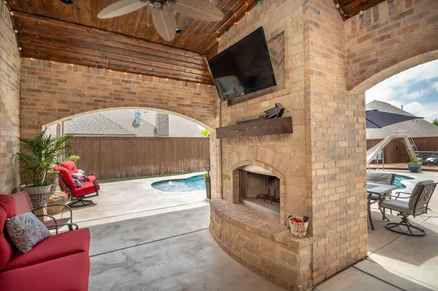 a view of sitting area with furniture in backyard