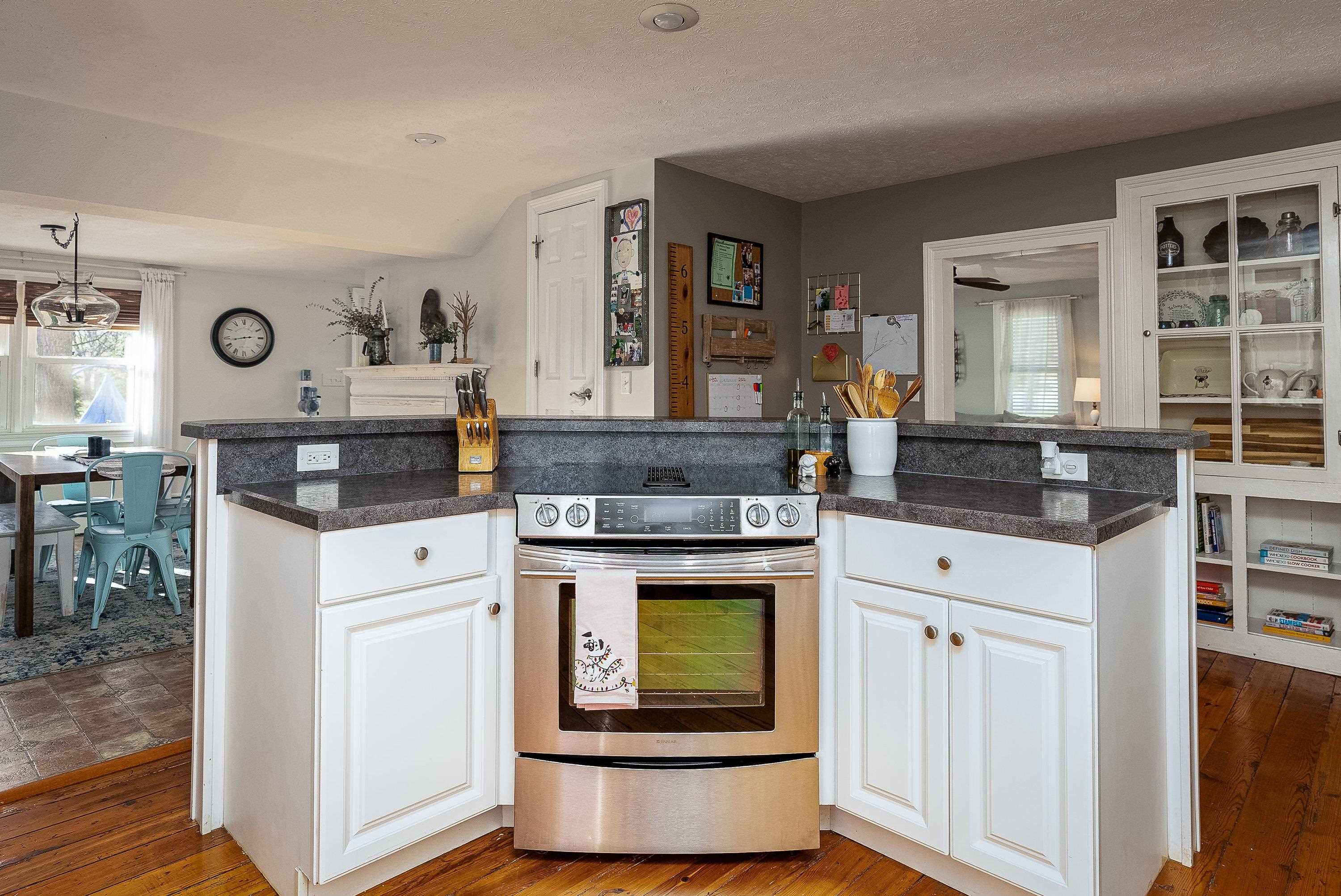 3667 Dry Hollow Road Dayton, VA 22821 - Photo 16 of 68 a kitchen with stainless steel appliances granite countertop a stove and cabinets