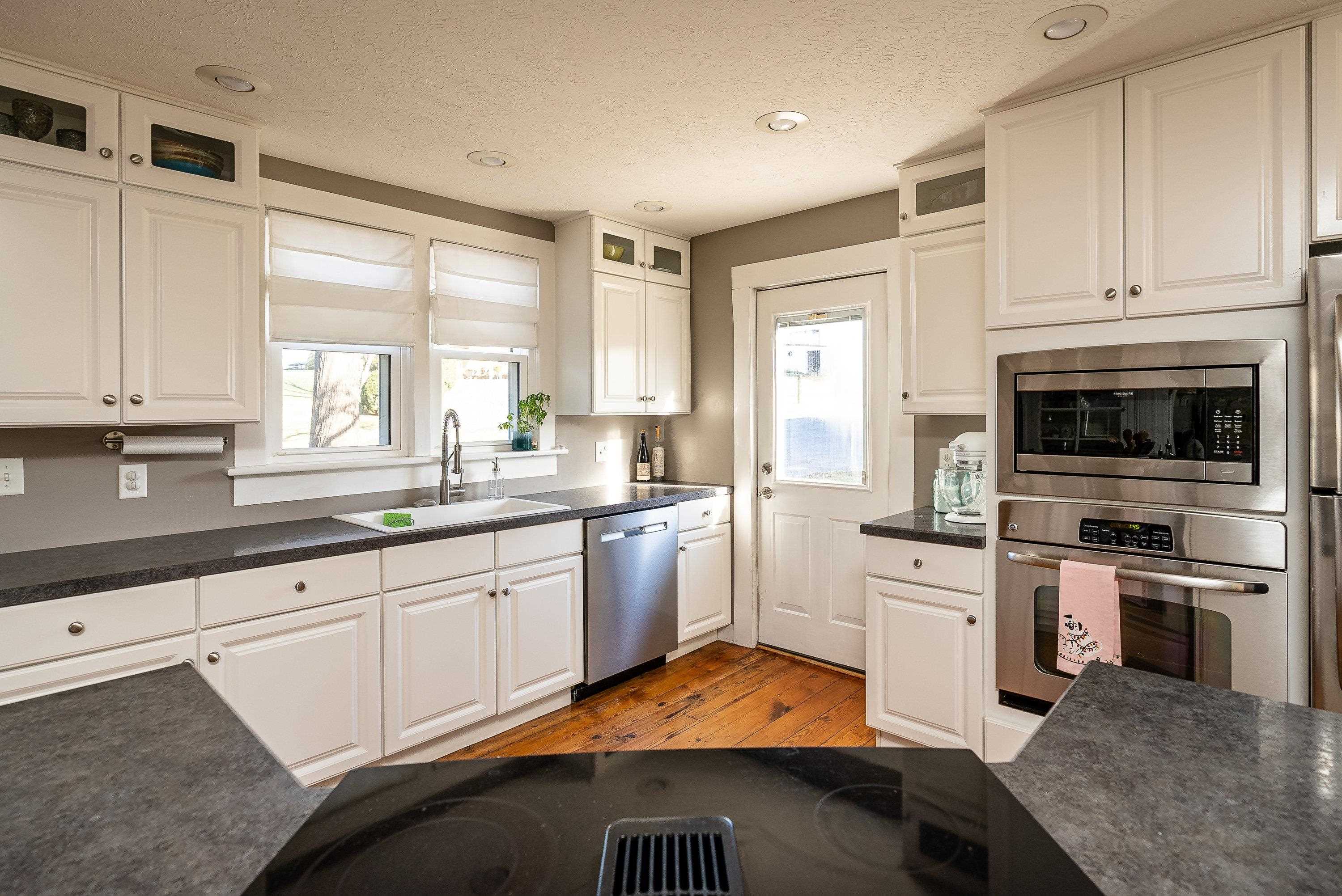 3667 Dry Hollow Road Dayton, VA 22821 - Photo 17 of 68 a kitchen with granite countertop a stove a sink and a refrigerator