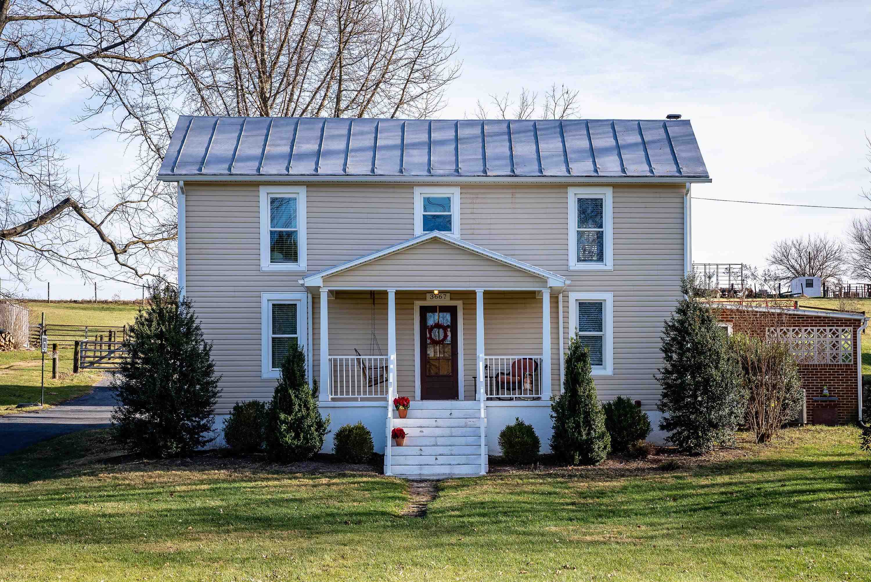 3667 Dry Hollow Road Dayton, VA 22821 - Photo 2 of 68 a front view of a house with a yard