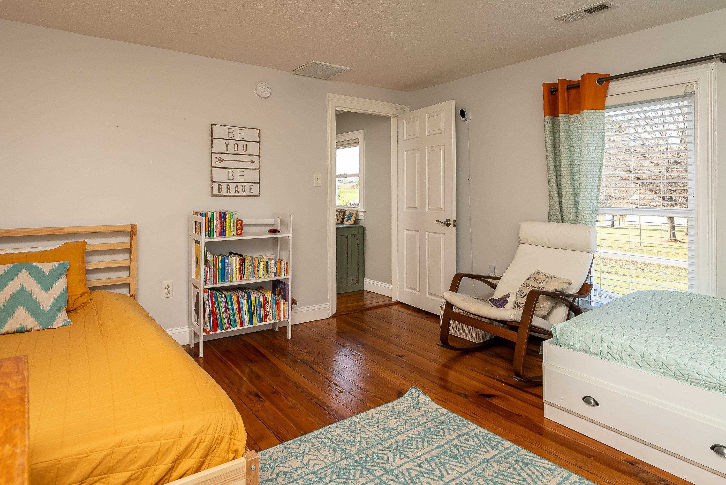 3667 Dry Hollow Road Dayton, VA 22821 - Photo 35 of 68 a bedroom with a bed and a book shelf