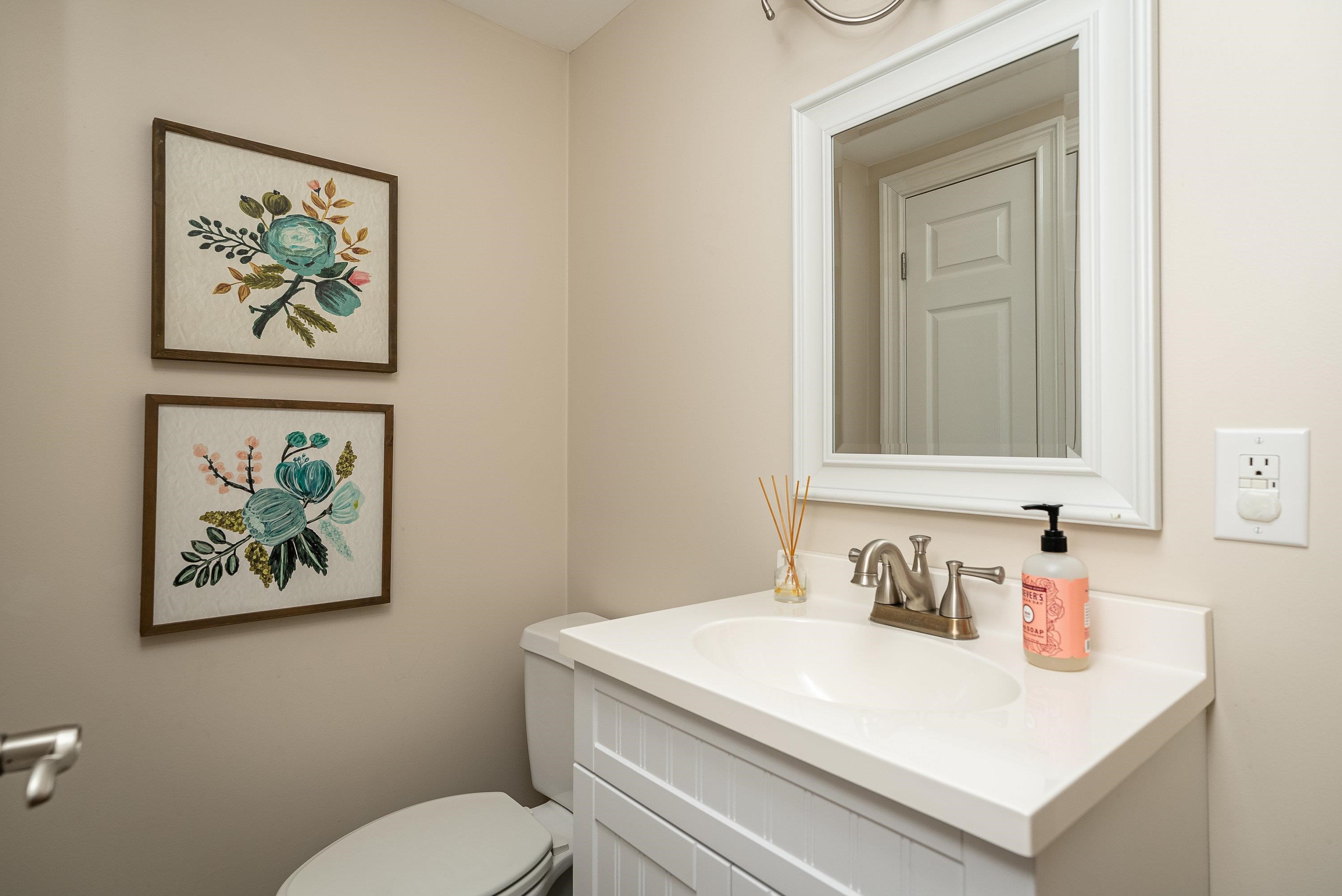 3667 Dry Hollow Road Dayton, VA 22821 - Photo 42 of 68 a bathroom with a toilet a sink and mirror