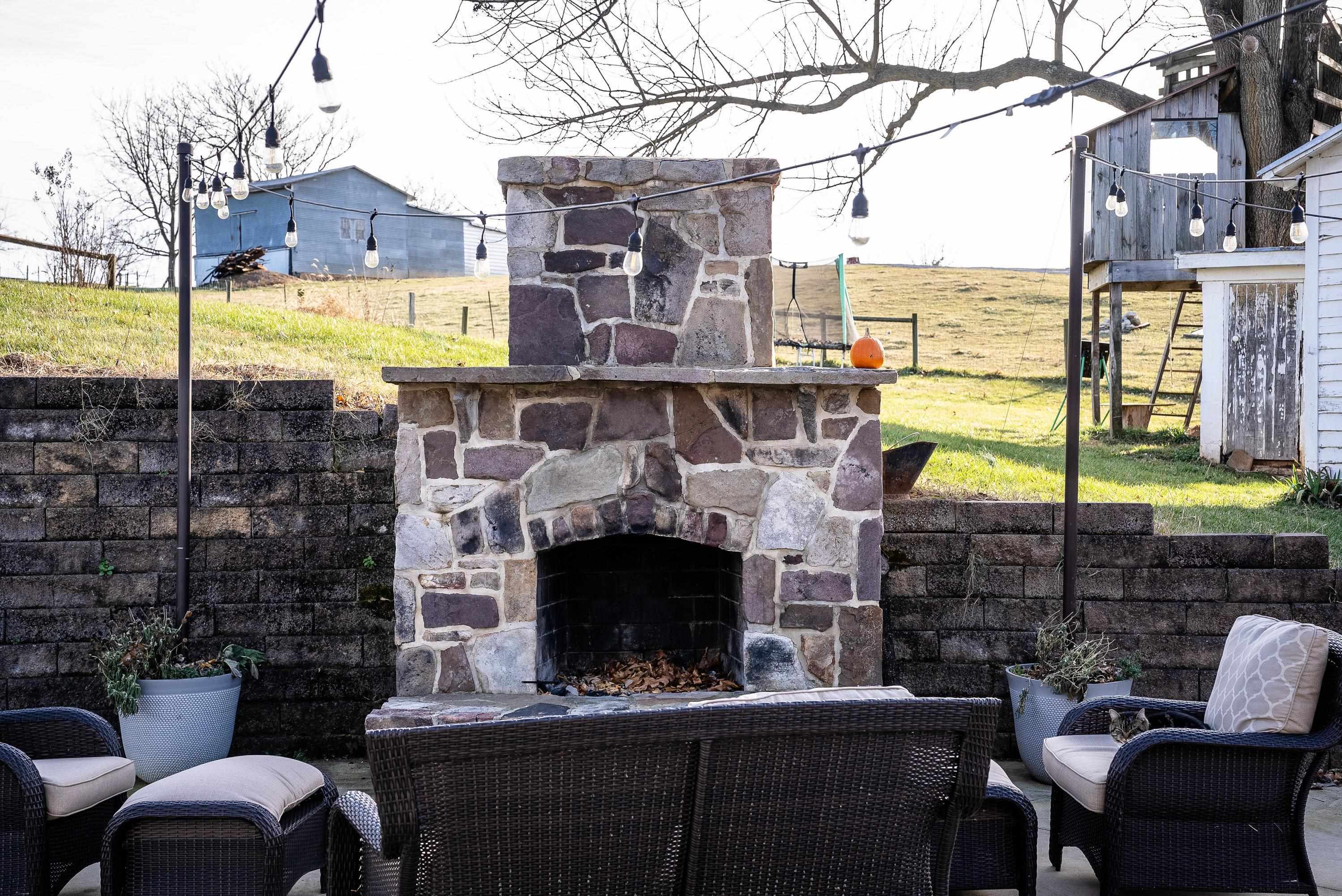 3667 Dry Hollow Road Dayton, VA 22821 - Photo 44 of 68 a view of a patio with a table chairs and a fire pit