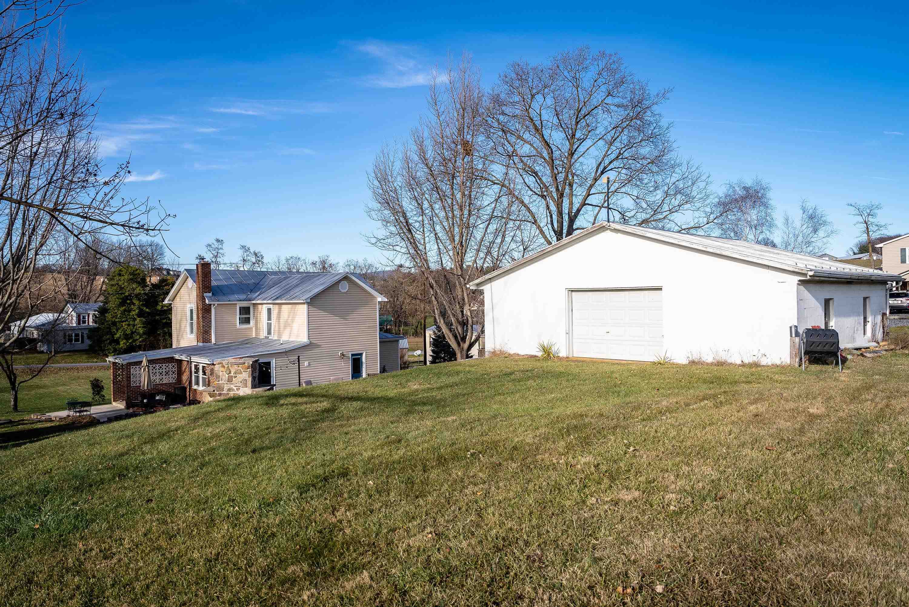 3667 Dry Hollow Road Dayton, VA 22821 - Photo 50 of 68 a view of a big house with a big yard and large tree