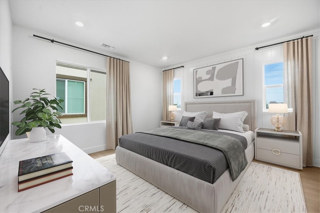 437 Willow Run Lane Carson, CA 90745 - Photo 16 of 37 a bedroom with a large bed and a couch