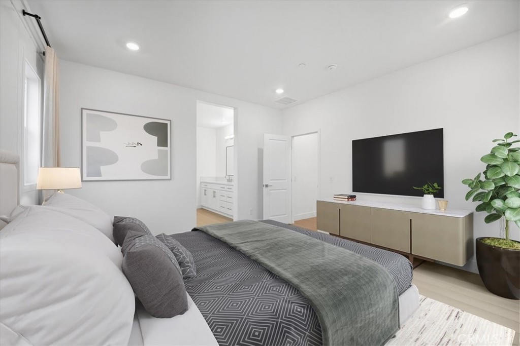 437 Willow Run Lane Carson, CA 90745 - Photo 17 of 37 a bedroom with a bed and a flat screen tv
