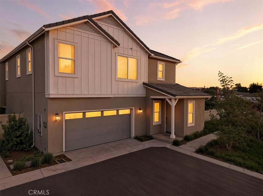 437 Willow Run Lane Carson, CA 90745 - Photo 2 of 37 a front view of a house with yard and parking