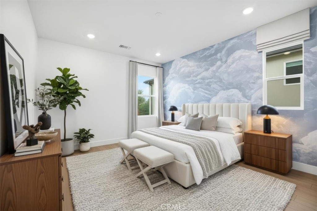 437 Willow Run Lane Carson, CA 90745 - Photo 22 of 37 a bedroom with bed and a potted plant