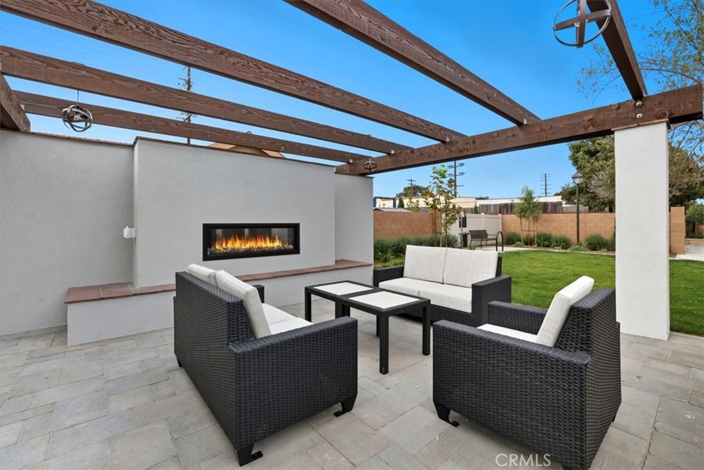 437 Willow Run Lane Carson, CA 90745 - Photo 30 of 37 a living room with furniture and a floor to ceiling window