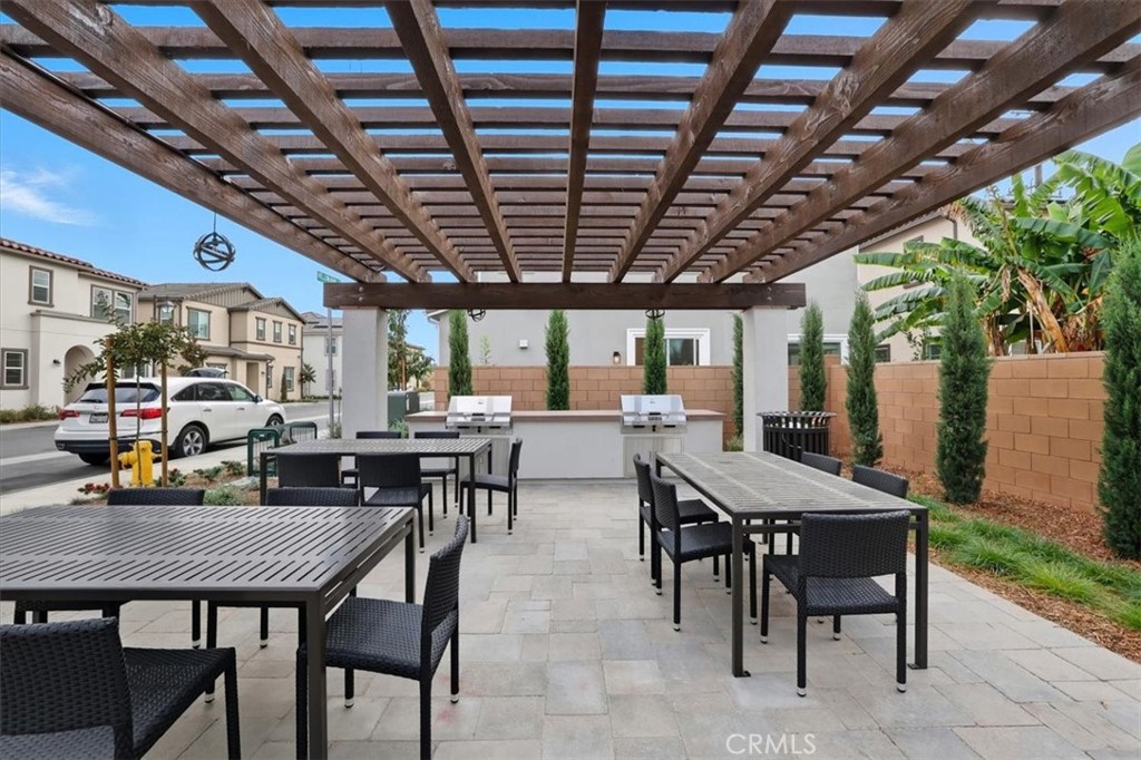 437 Willow Run Lane Carson, CA 90745 - Photo 32 of 37 a view of a dinning table and chairs in the patio