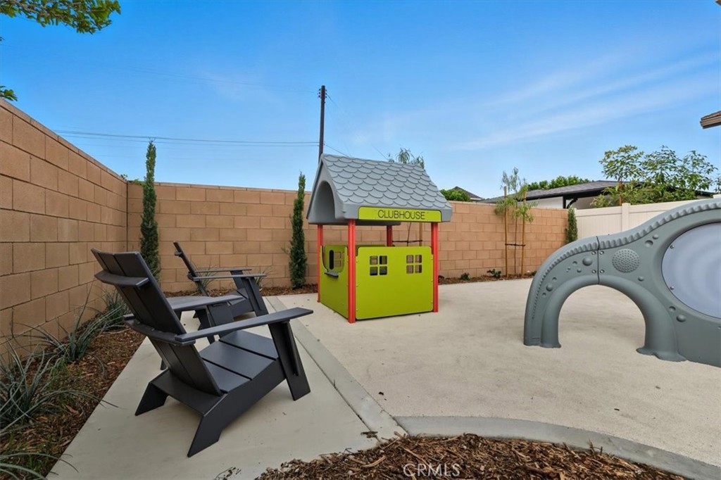 437 Willow Run Lane Carson, CA 90745 - Photo 35 of 37 a roof deck with table and chairs