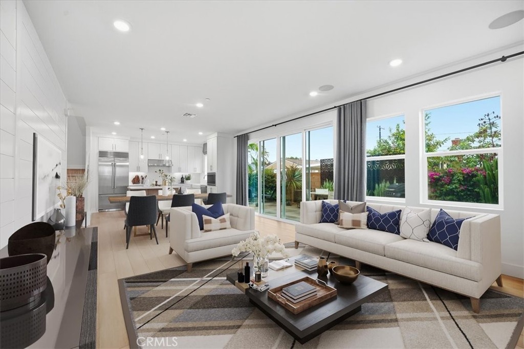 437 Willow Run Lane Carson, CA 90745 - Photo 4 of 37 a living room with furniture large windows and a table