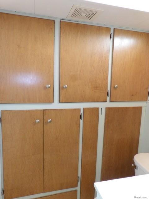 9681 Allen Road Allen Park, MI 48101 - Photo 63 of 65 62B. ONE WALL WITH BUILT-IN CABINETS!