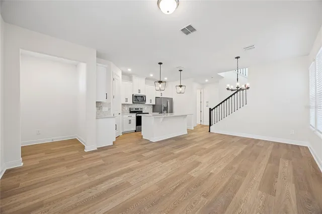 a view of kitchen with wooden floor