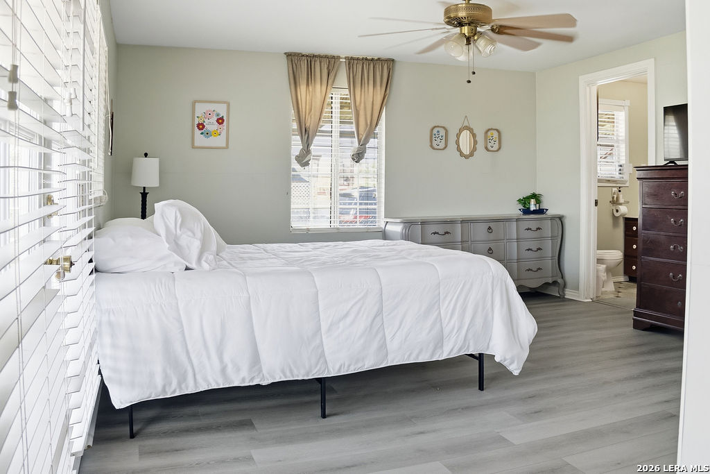 116 Matlock Poth, TX 78147 - Photo 28 of 41 a bedroom with a bed and wooden floor