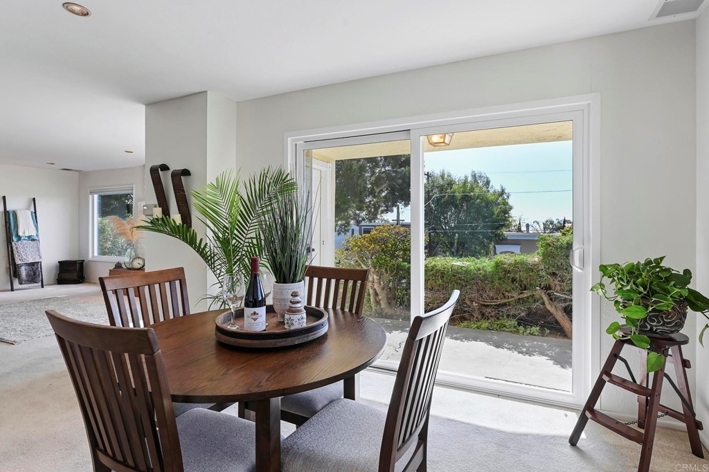 837 Passiflora Avenue Encinitas, CA 92024 - Photo 12 of 42 a view of a dining room with furniture window and outside view