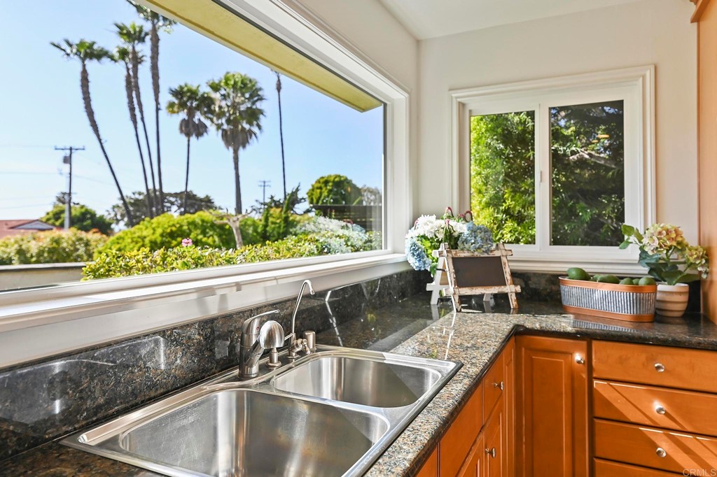 837 Passiflora Avenue Encinitas, CA 92024 - Photo 19 of 42 a kitchen with a sink and a large window