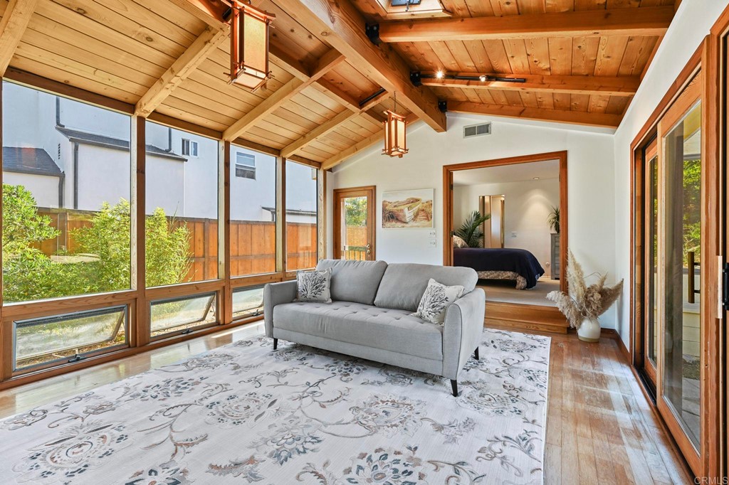 837 Passiflora Avenue Encinitas, CA 92024 - Photo 26 of 42 a living room with furniture and a large window