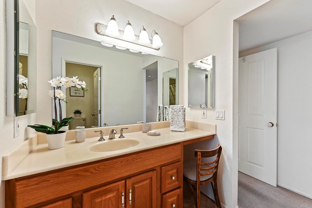 837 Passiflora Avenue Encinitas, CA 92024 - Photo 28 of 42 a bathroom with a sink double vanity and a mirror