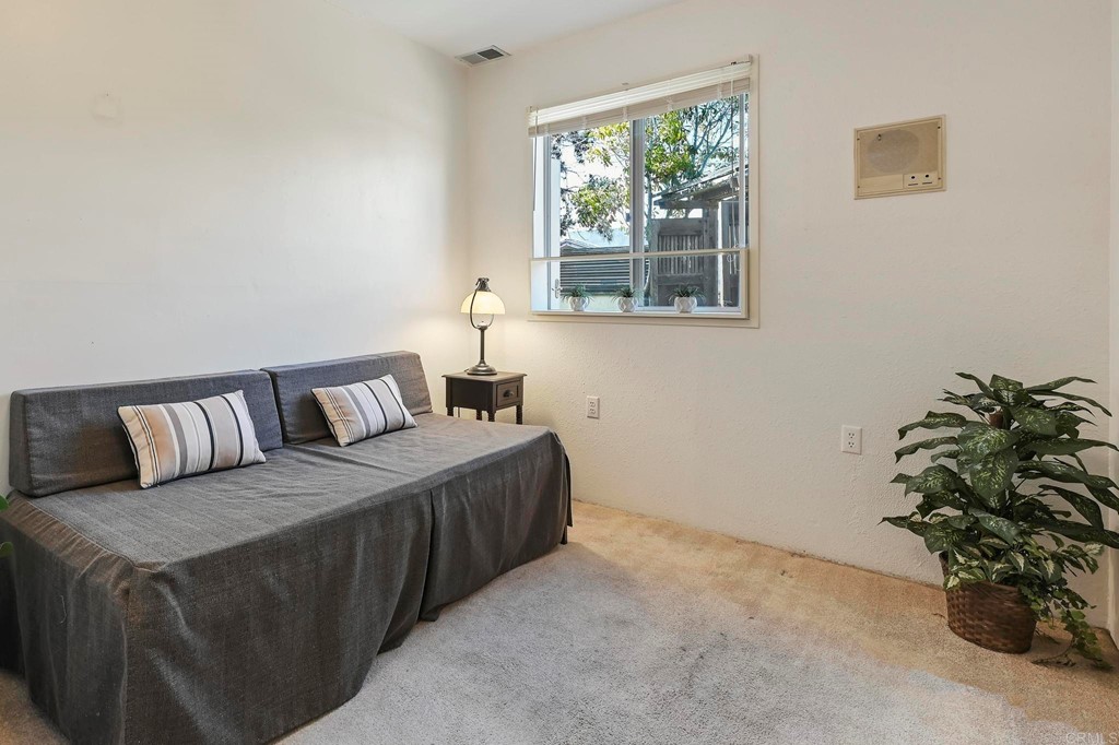 837 Passiflora Avenue Encinitas, CA 92024 - Photo 33 of 42 a bedroom with a bed and a window