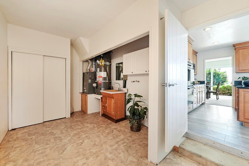 837 Passiflora Avenue Encinitas, CA 92024 - Photo 34 of 42 a view of a kitchen and an empty room
