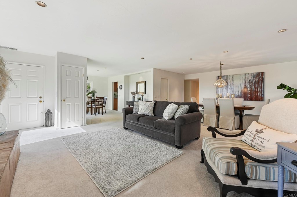 837 Passiflora Avenue Encinitas, CA 92024 - Photo 7 of 42 a living room with furniture a rug and white walls