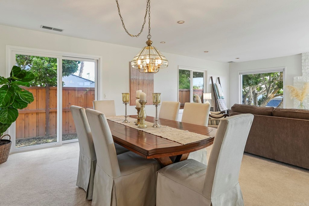837 Passiflora Avenue Encinitas, CA 92024 - Photo 9 of 42 a view of a dining room with furniture window and outside view