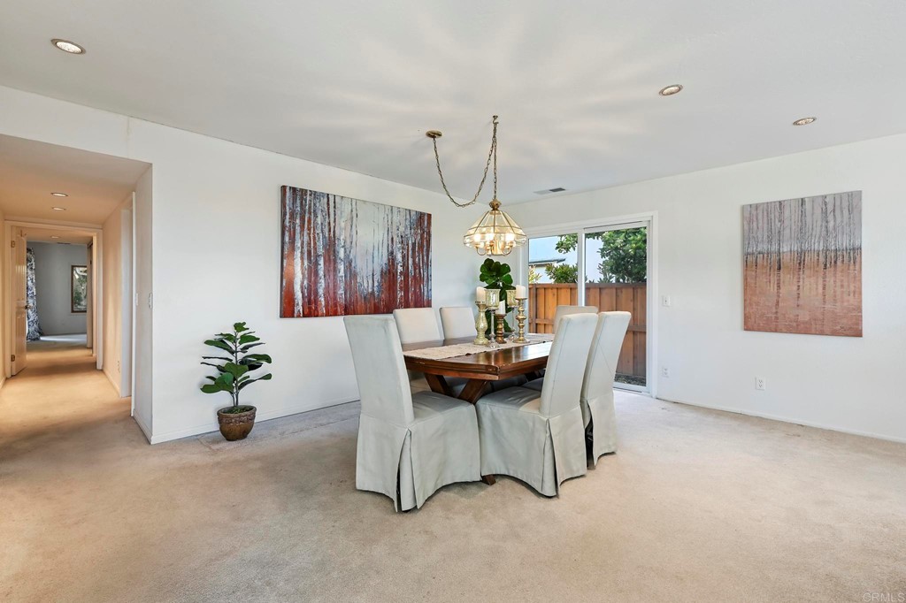 837 Passiflora Avenue Encinitas, CA 92024 - Photo 10 of 42 a dining room with furniture and window