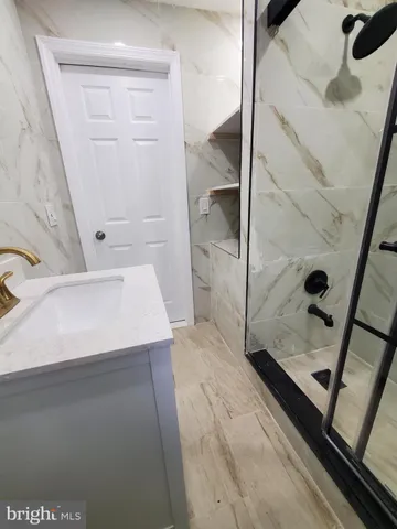 a bathroom with a sink and a shower