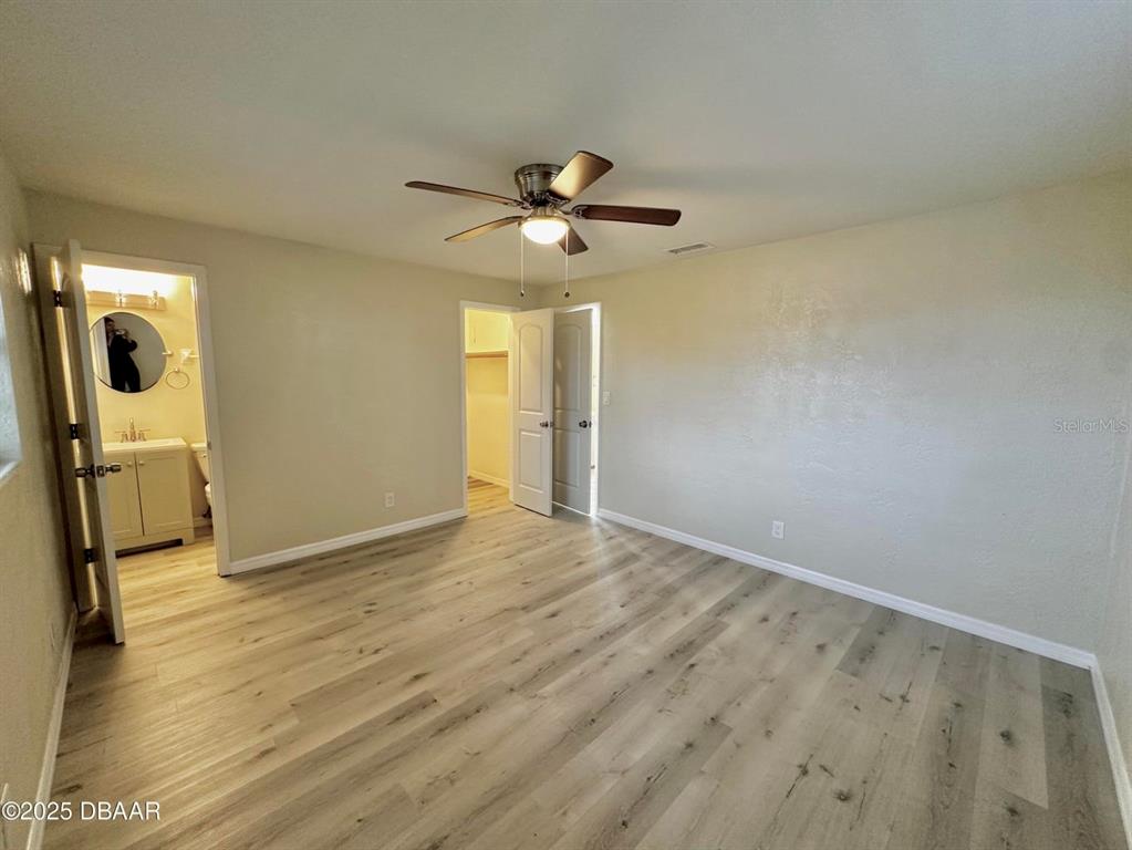 1022 4th Street Port Orange, FL 32129 - Photo 11 of 21 wooden floor in an empty room