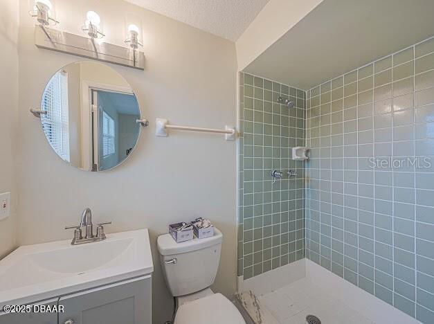 1022 4th Street Port Orange, FL 32129 - Photo 12 of 21 a bathroom with a toilet a sink a mirror and bathtub