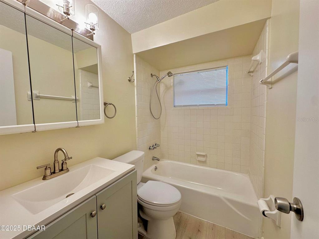 1022 4th Street Port Orange, FL 32129 - Photo 15 of 21 a bathroom with a sink a toilet and shower