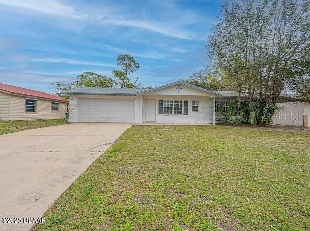 1022 4th Street Port Orange, FL 32129 - Photo 18 of 21 a front view of a house with a garden