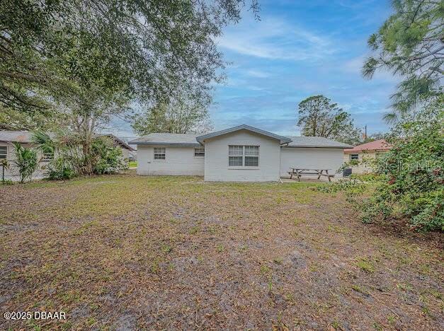 1022 4th Street Port Orange, FL 32129 - Photo 19 of 21 a view of house with backyard and trees