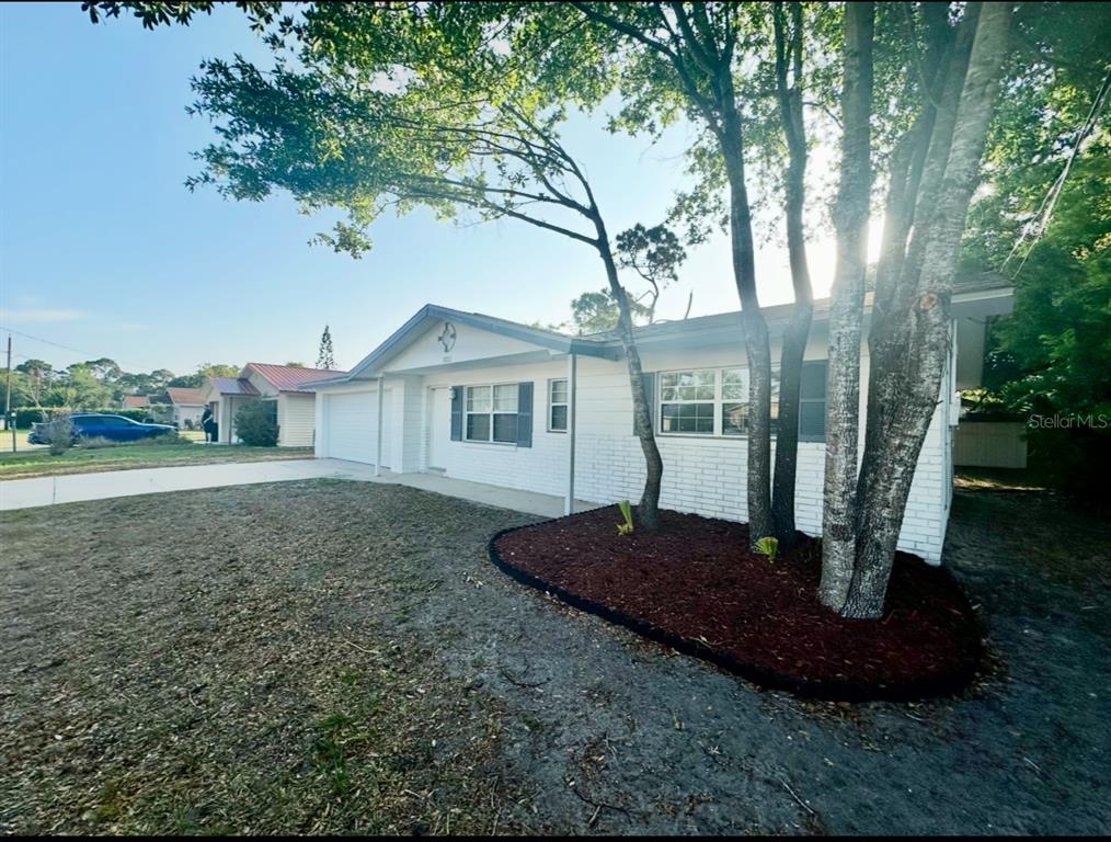 1022 4th Street Port Orange, FL 32129 - Photo 3 of 21 a view of a house with backyard and garden