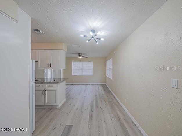 1022 4th Street Port Orange, FL 32129 - Photo 7 of 21 wooden floor in an empty room with a kitchen