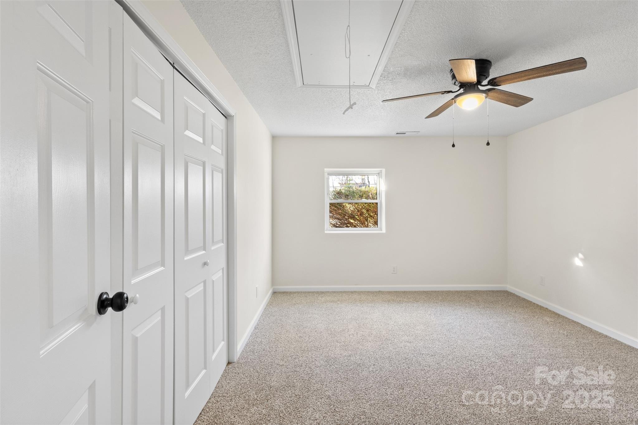 717 Perth Road Troutman, NC 28166 - Photo 11 of 15 a view of an empty room with a window