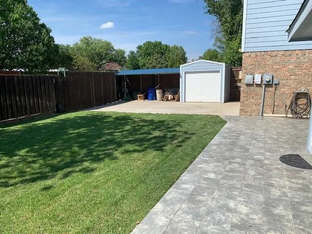 a view of a back yard with green space